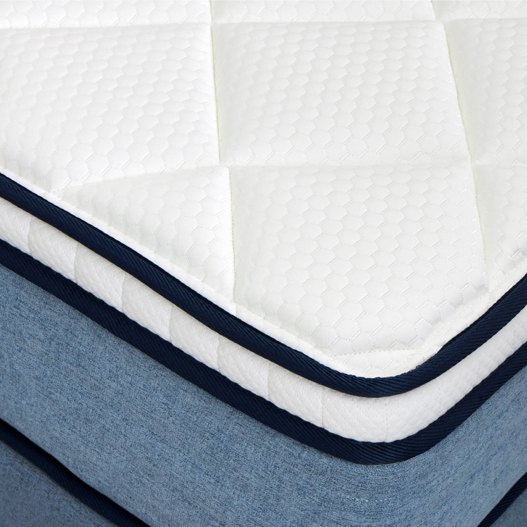 a-close-up-view-of-the-coway-prime-lite-series-mattress-white-fabric