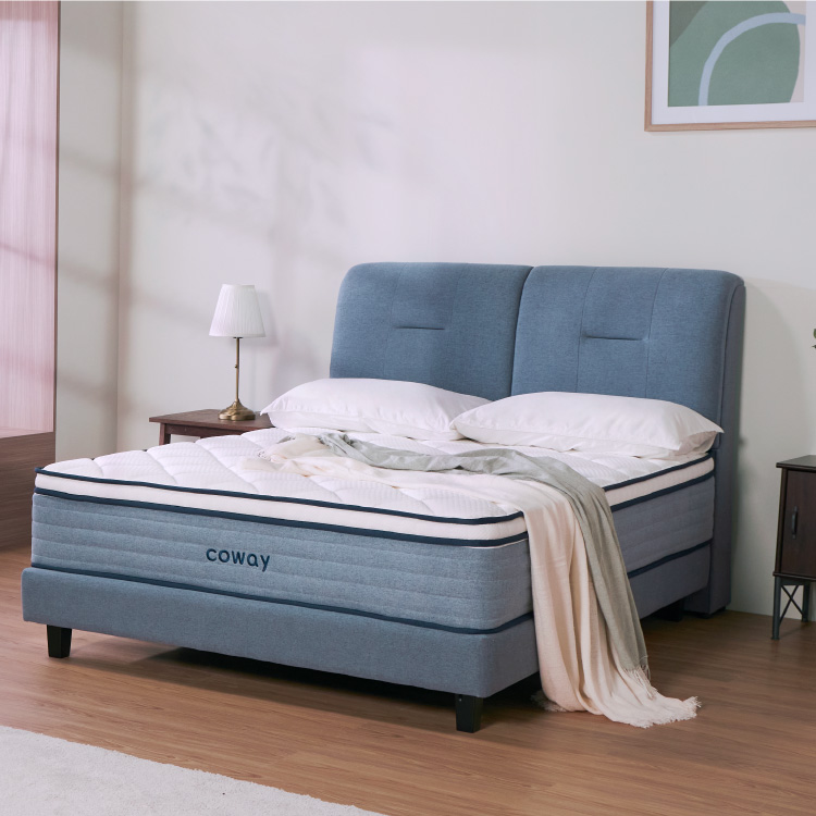 a-front-shot-of-the-coway-prime-lite-series-mattress-in-a-bedroom
